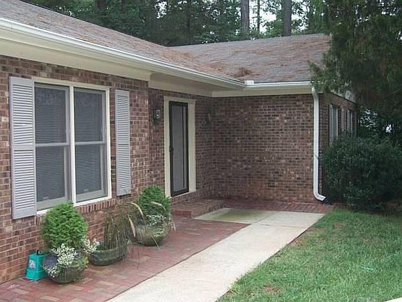 Paved front area and left side good for your plants or other outdoor items.