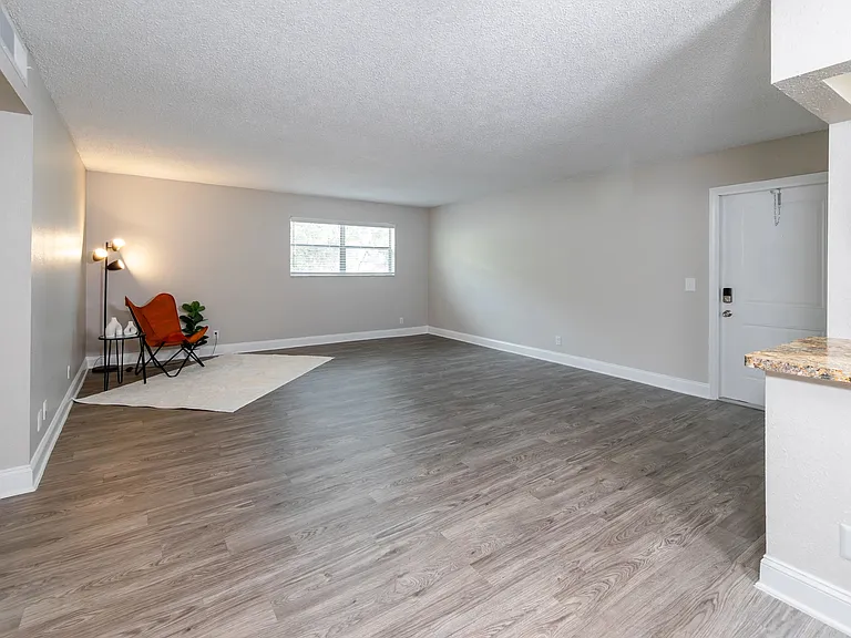 Kick back and relax in spacious living rooms with sleek wood-style floors.