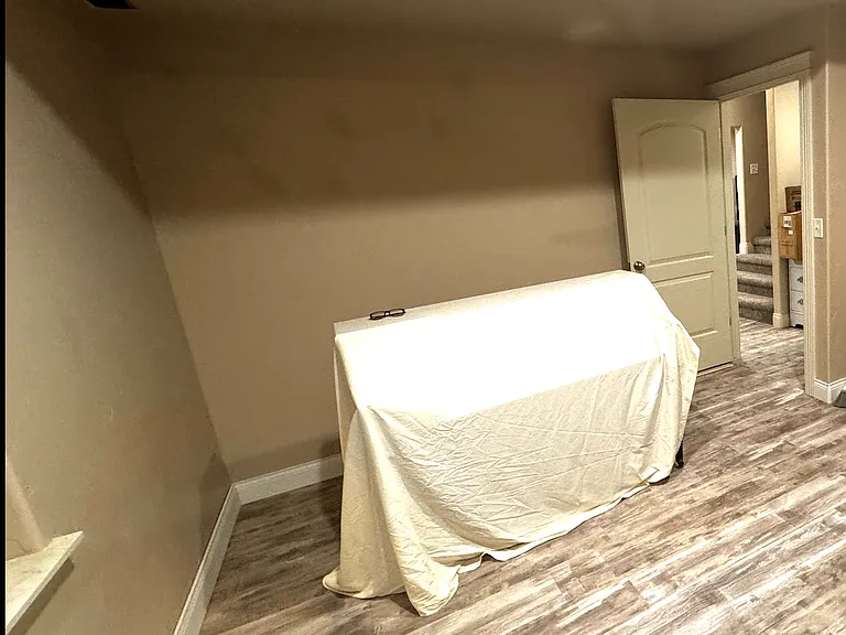 Second bedroom. Includes built-in bookcase and desk. New floors and paint.