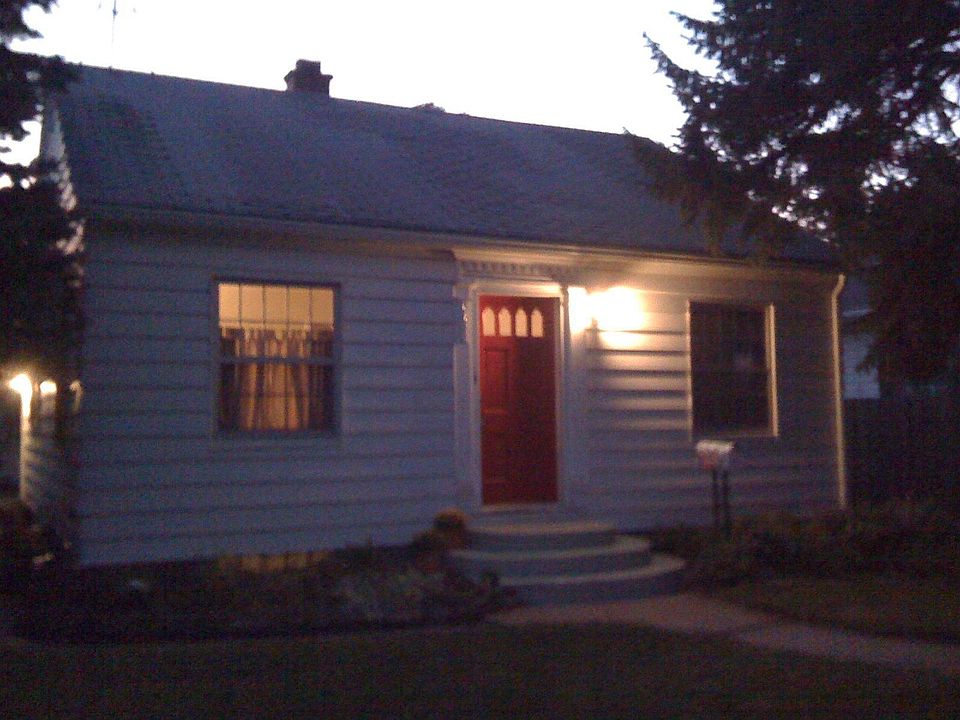 Look for the red front door.