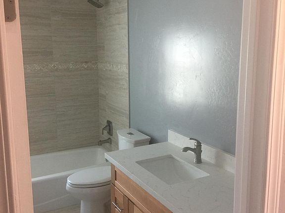 Large bathroom (shower door and mirror to be installed)