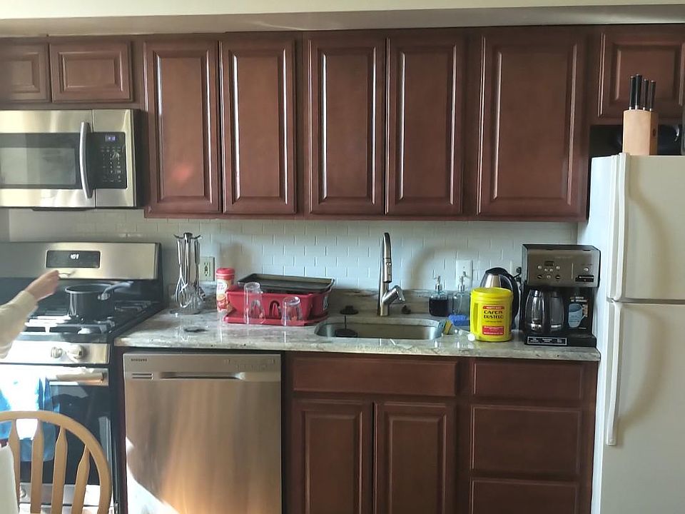 kitchen with new granite countertops and stainless steel appliances