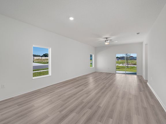 Spacious family room with vinyl flooring