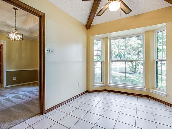 Breakfast Room as Ceiling Fans, Wooden Beams and Pretty Bay Window