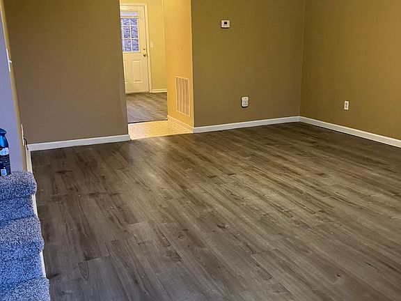 Fresh paint new flooring in spacious living room