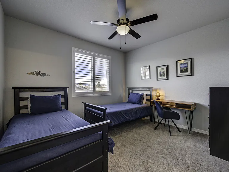 Twin Bedroom
Upstairs bedroom with two twin beds, desk, and dresser