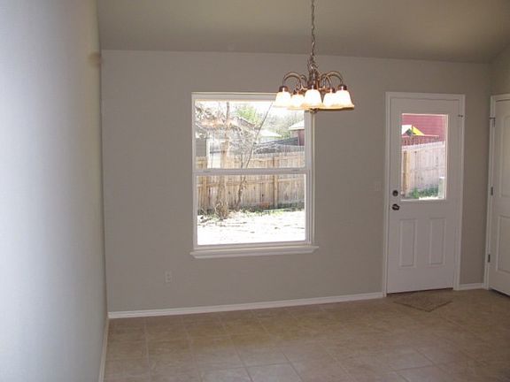 Large nook is open to kitchen
