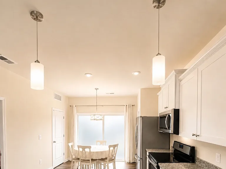 Dining/Eating Area. Large Sliding Glass Door Leading to Covered Patio/ Private Backyard