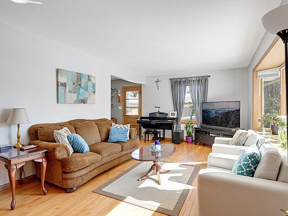 Living room with windows on South and West sides, for a light and bright home!
