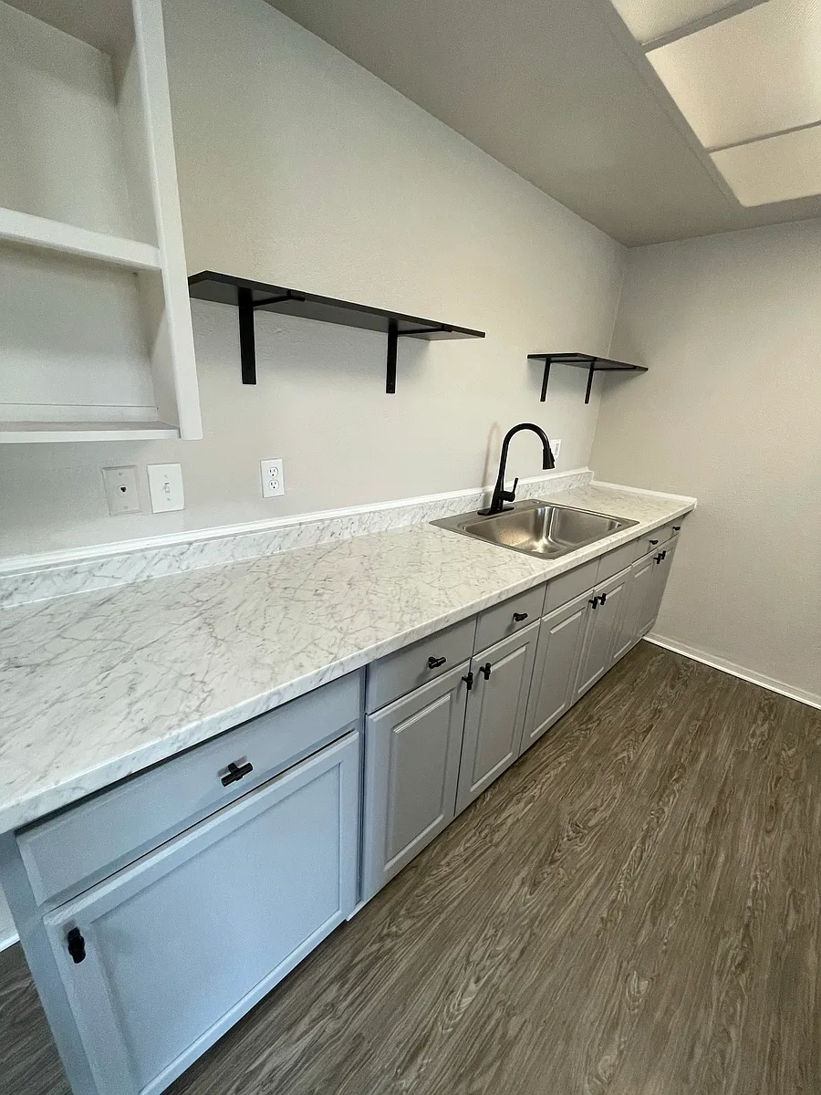 kitchen sink and cabinet storage - 4219 Trevor Ln #C
