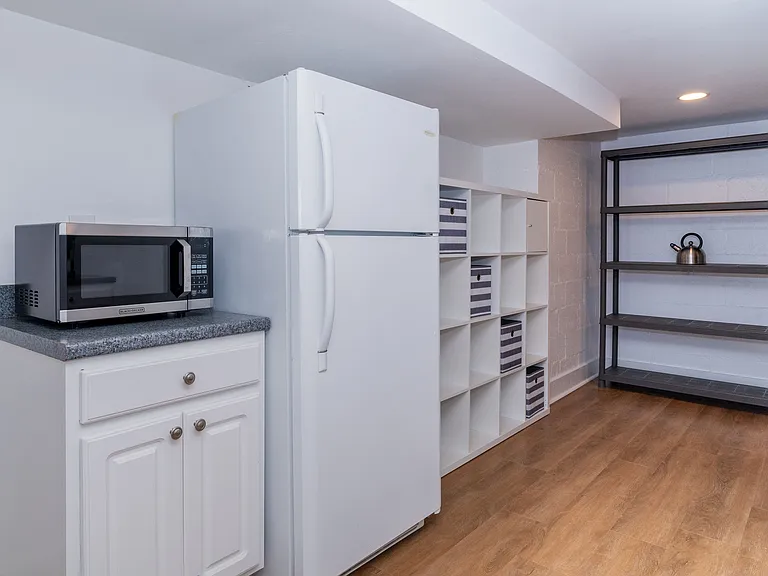 Full size fridge and lots of pantry space in the kitchen.