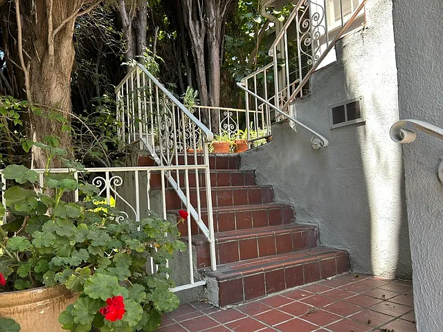 Adjacent stairs lead directly to assigned parking space.