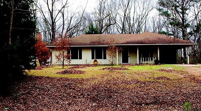 Early Spring time photo of the front of the house and yard.