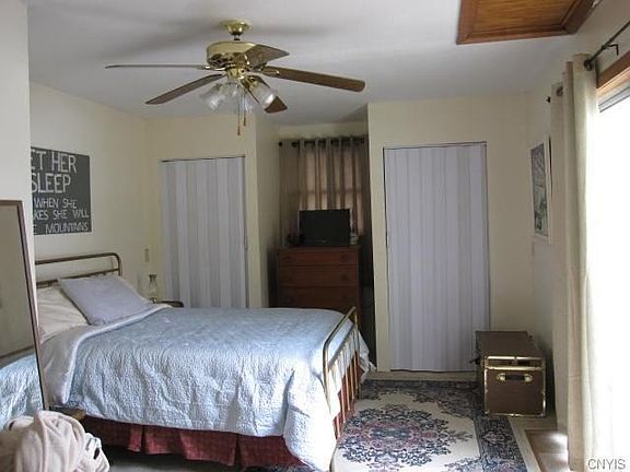 The upstairs bedroom encompasses the entire top floor.  The bright light on the righthand side of the photo comes from the sliding glass door that opens to the balcony.  Private and light!