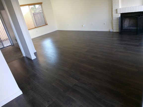 Beautiful Pergo Flooring in the Living Room that opens to Dining Room.