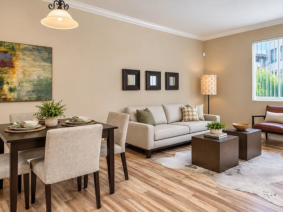 Step into elegance at The Pointe, where modern design meets comfort. This inviting living space features stylish furnishings and warm tones, perfect for relaxation or gatherings. Explore your new home today!