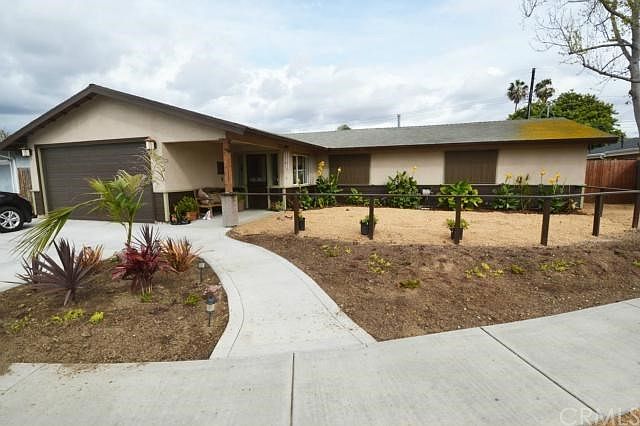 Front view showing Xeriscape landscape on City Waterwise program. Cul-de-sac location- does not side