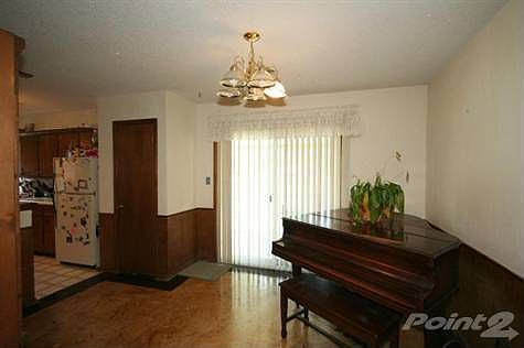 Formal dining with concrete flooring, access to covered patio