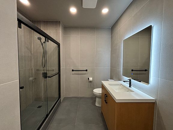 Main Floor Bathroom NEW
Toto Toilet
Delta Shower
Tile Throughout
Walk-In Shower