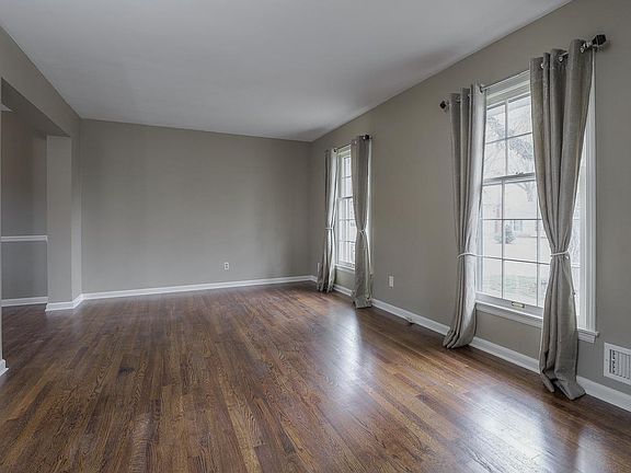 Pretty, bright family room flows into the dining room or kitchen, and a few steps down to the family room.