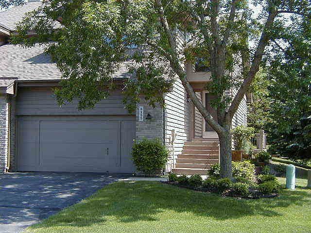 Nice end unit nestled in beautiful evergreen trees
