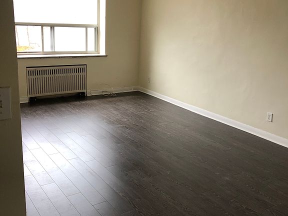 Large living area with nook that can be used for a desk (not seen in photo).