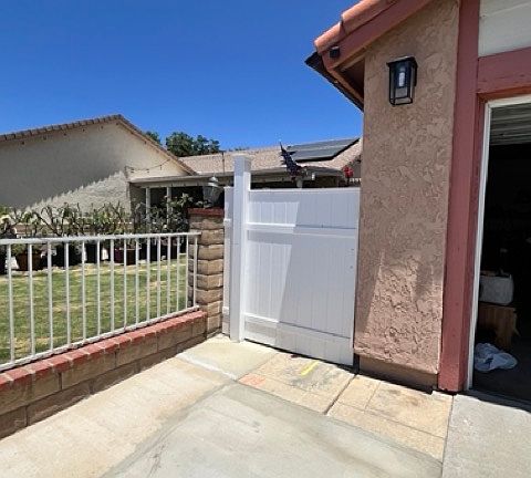 Private side entrance is gated beside main home