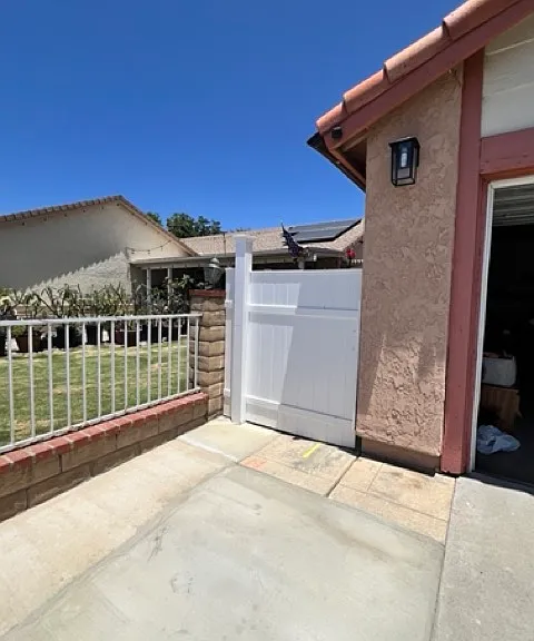 Private side entrance is gated beside main home