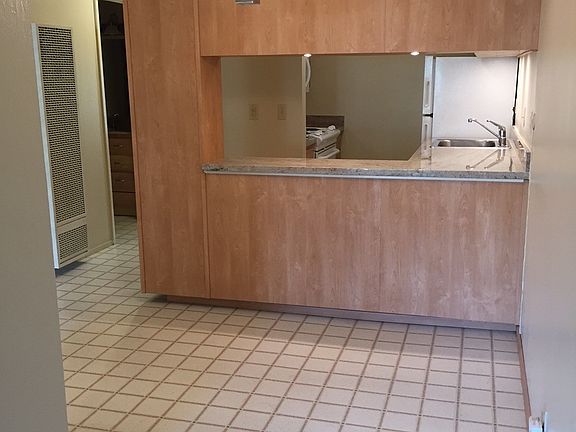 Kitchen opens to dining area