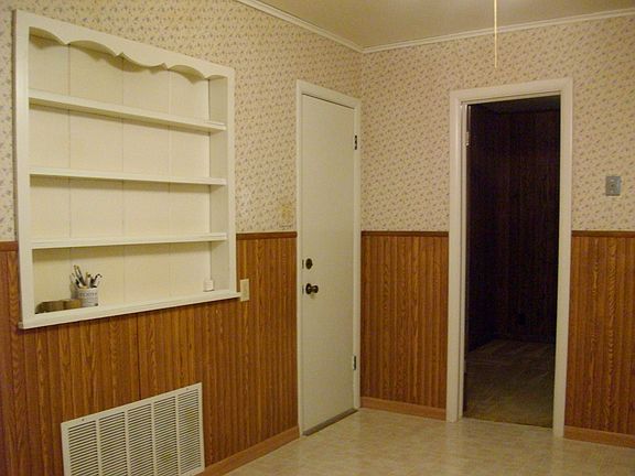 Kitchen with door to carport.