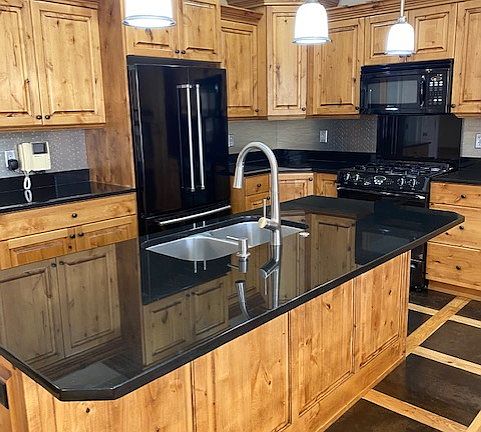 kitchen with knotty alder cabinets and kitchenaid appliances