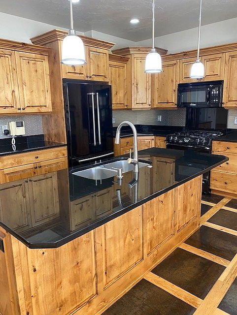 kitchen with knotty alder cabinets and kitchenaid appliances