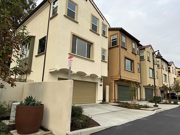 A 2-car parking garage with a driveway that fits as many + street parking.