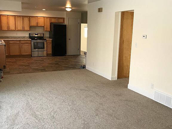 Large open-concept kitchen/dining/livingroom.