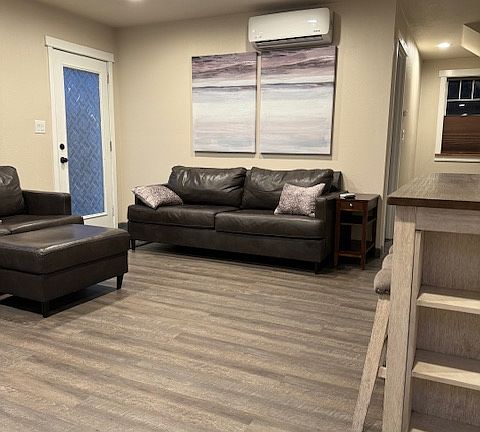 living area with high-end leather couch and loveseat