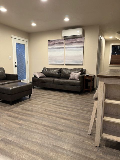 living area with high-end leather couch and loveseat