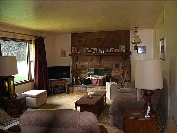 Living room with beautiful view of fireplace