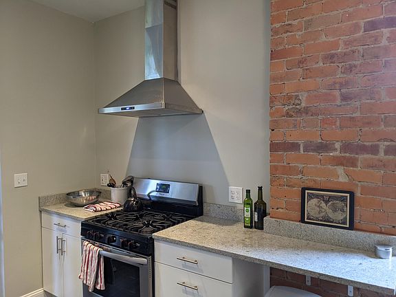 Gas range and exposed brick