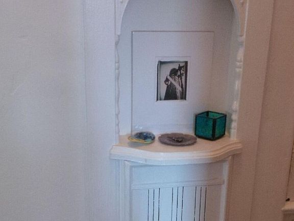 Telephone nook in the hallway_below the nook is a fold out chair, all designed in the 1930s