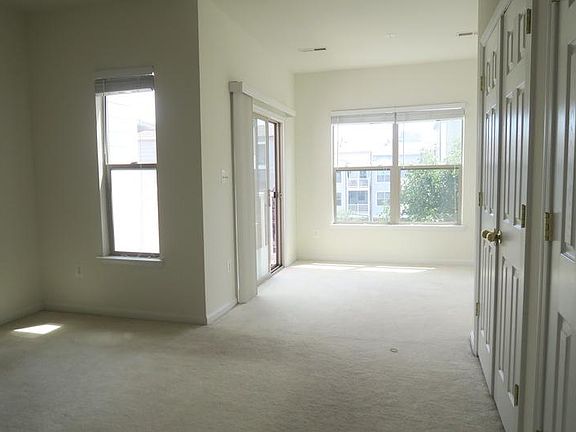Spacious master bedroom with very tall ceilings