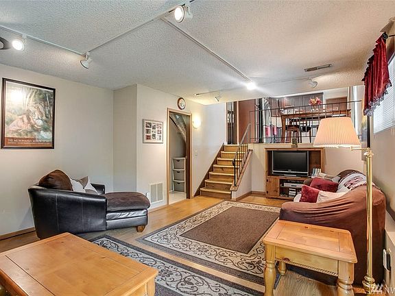 Huge Family Room.  The open doorway to the left will take you to the laundry room, half bathroom and the 4th bedroom.