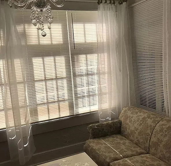 Florida Room Entrance with windows on three sides. crystal chandlier