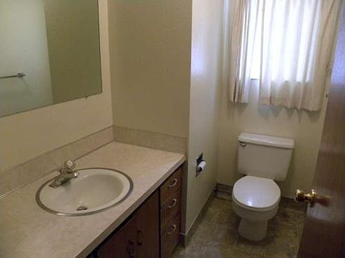 dressing room with toilet and huge mirror