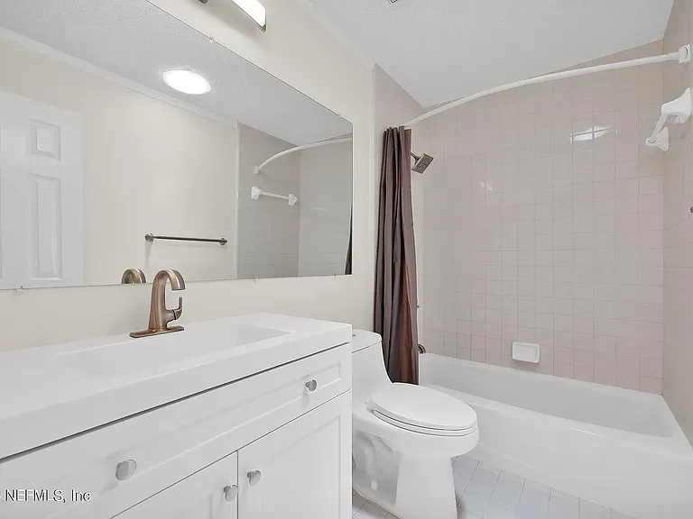 Upstairs bathroom with tub