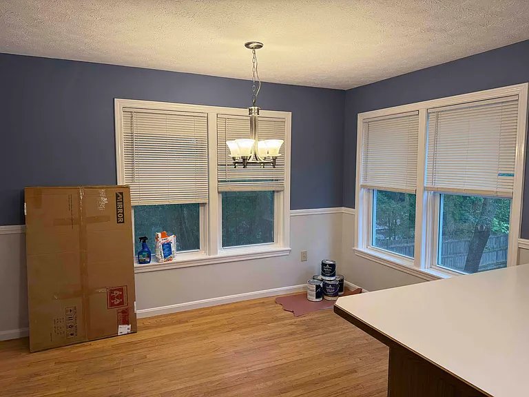 Dining room (still see the paint cans), middle counter divides kitchen