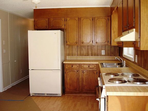 Easy Access & Use in this Modernized Kitchen. Beautiful Wood Cabinets!