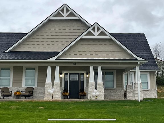 Large front porch with eating area. oversized garage single car garage with own private driveway