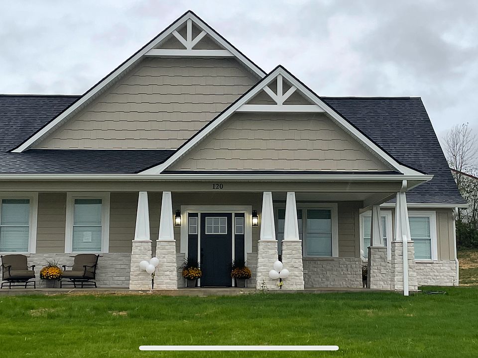 Large front porch with eating area. oversized garage single car garage with own private driveway