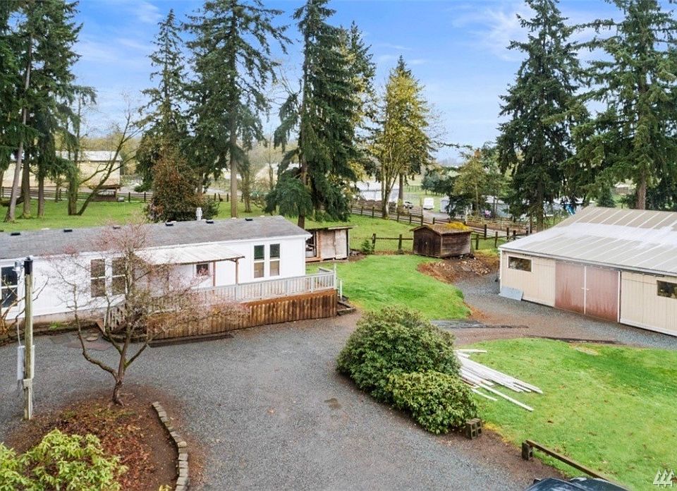 1/2 AC property with approximately 2,000 SQ FT garage/shop with 1986 manufactured home with 3 bedrooms and 2 baths.