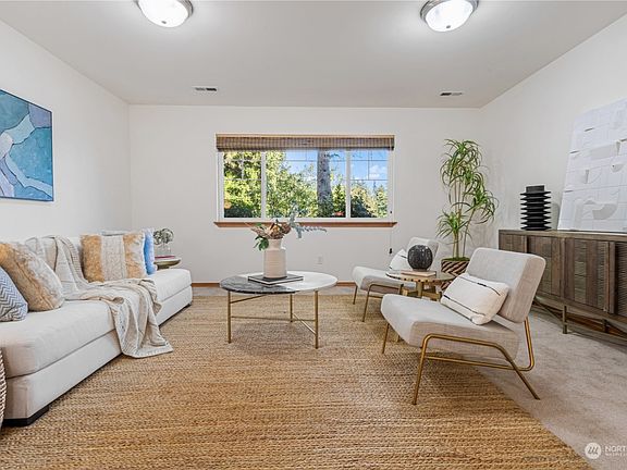 Living area (staged). The carpet has been replaced with LVP now as shown in other pictures.